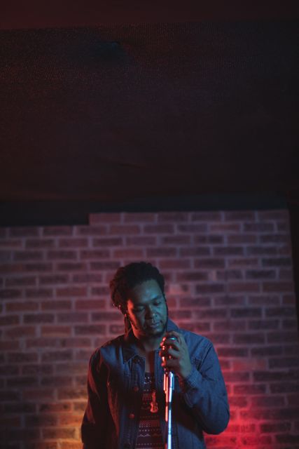Male singer performing in nightclub - Download Free Stock Photos Pikwizard.com