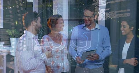 Diverse Business Team Engaging with Digital Data Interface in Office