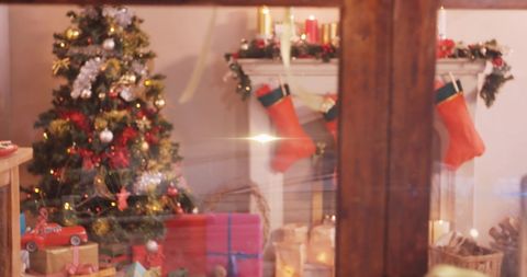Cozy Christmas Interior with Tree and Stockings by Fireplace
