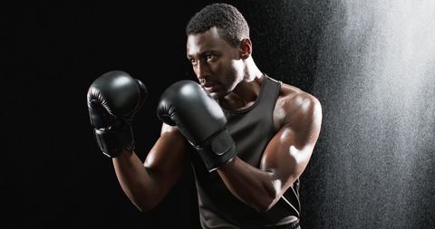 Focused african american boxer in intense pre-fight stance