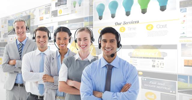 This image shows a group of call center executives standing in an office environment with their arms crossed, wearing headsets and smiling. It can be used for business and corporate websites, customer service promotions, teamwork and collaboration themes, and technology-related content.
