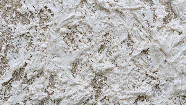 Showcasing off-white gesso impasto texture with torn canvas and knife marks