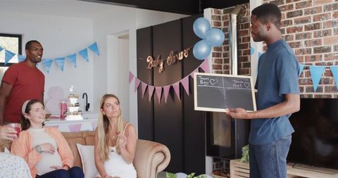 Diverse Friends Enjoying Baby Shower with Games and Laughter