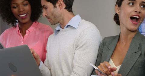 Business Team Collaborating with Technology in Office Setting