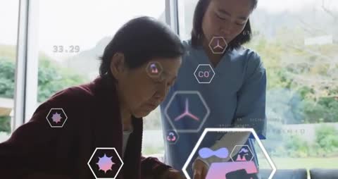 Nurse Using Technology to Monitor Senior Woman's Health Metrics