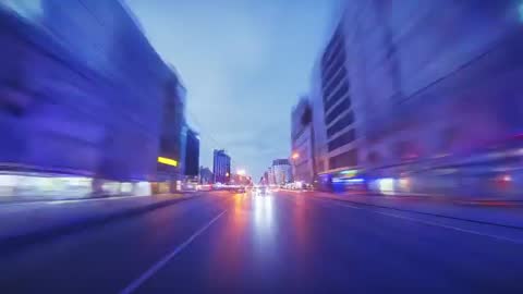 Twilight City Drive Moving Through Neon-Lit Wet Streets with Motion Blur and Reflections