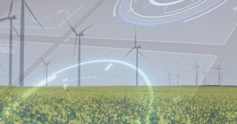 Wind turbines lining horizon over canola field with futuristic HUD overlay and cyan accents