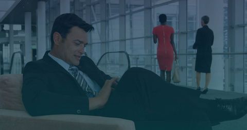 Businessman Using Tablet in Modern Office Foyer - Download Free Stock Images Pikwizard.com
