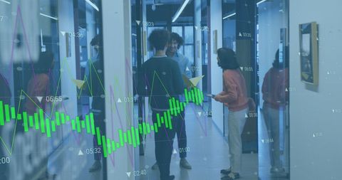 Business team discussing with overlay of graphs and financial data