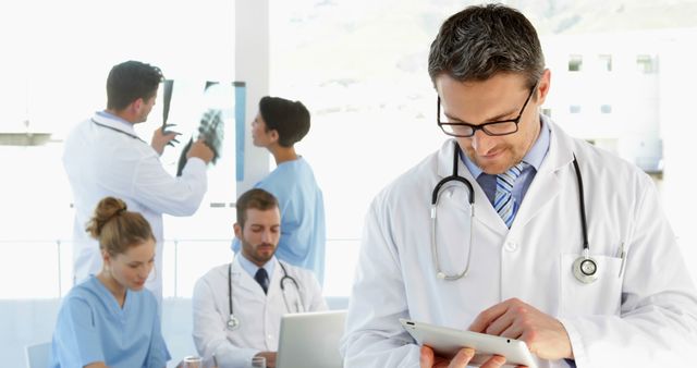 Doctors Collaborating in Hospital Office with Medical Equipment - Download Free Stock Images Pikwizard.com