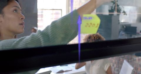 Innovative Businesswomen Analyzing Data in Modern Office