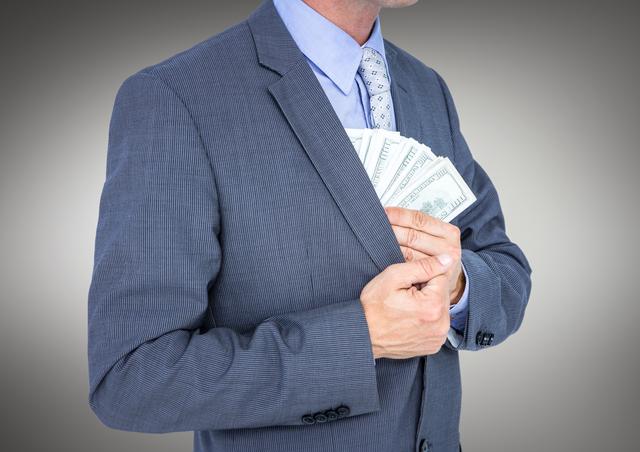 Businessman concealing cash inside suit jacket, implying corruption or illegal financial activities. Useful for topics related to crime, bribery, corporate fraud, hidden wealth, and ethical dilemmas in business.