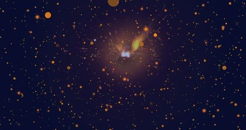 Golden sparks from handheld sparkler against deep blue night sky