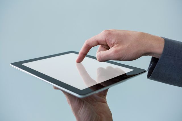 Hand of businessman using digital tablet