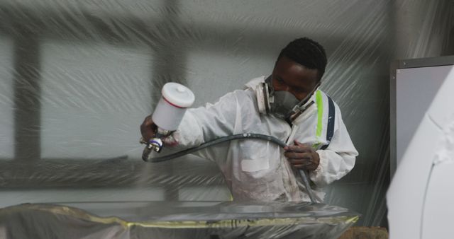 Manual Worker Using Spray Gun in Workshop - Download Free Stock Images Pikwizard.com