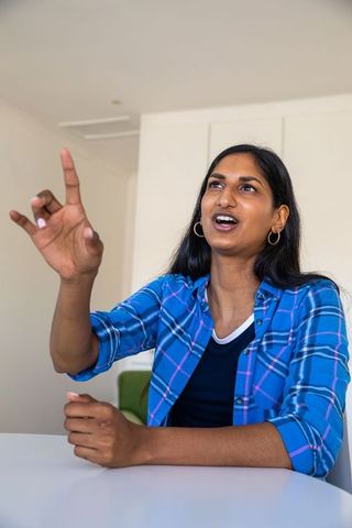 Confident indian woman engaging in corporate discussion