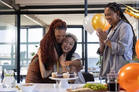 Joyful Birthday Celebration Among Coworkers in Office