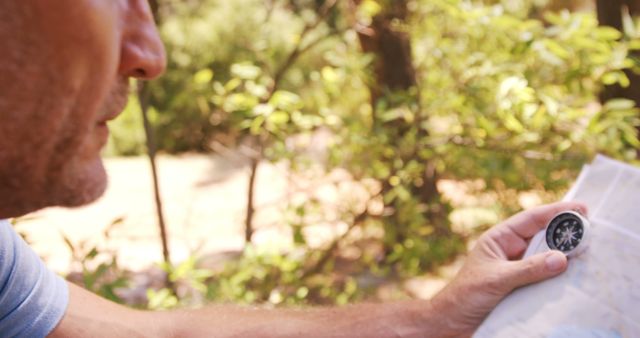 Hiker Navigating with Compass and Map in Forest - Download Free Stock Images Pikwizard.com