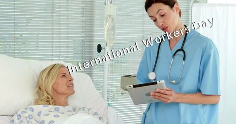 Medical professional consulting patient on international workers day