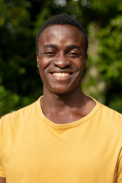 Close-up portrait of happy african american young man in backyard - Download Free Stock Photos Pikwizard.com