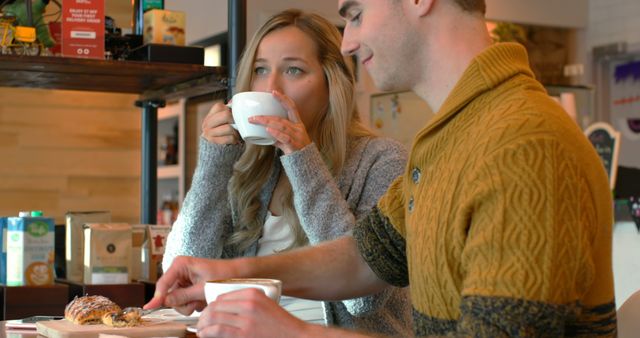 Young Couple Enjoying Coffee and Pastries at Cozy Café - Download Free Stock Images Pikwizard.com