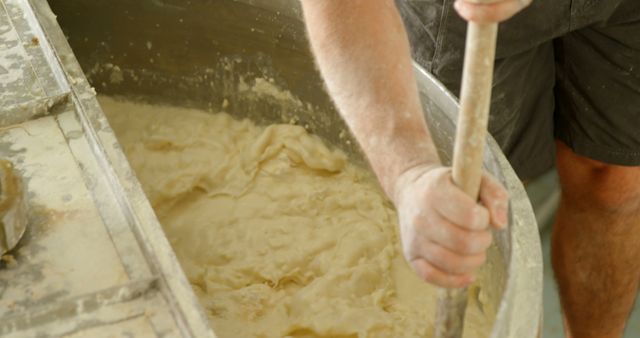 Baker Kneading Dough in Large Metal Basin - Download Free Stock Images Pikwizard.com