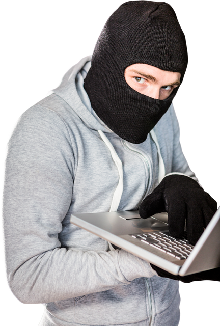 Burglary Concept: Masked Young Male Working on Laptop in Black Clothes - Download Free Stock Videos Pikwizard.com