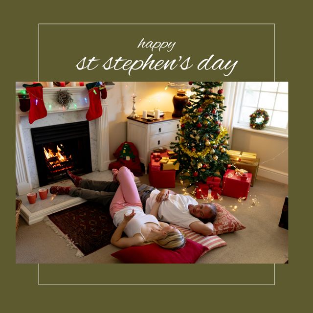 Composition of st stephen's day text and diverse couple at christmas by fireplace. St stephen's day, boxing day, christmas tradition and celebration concept digitally generated image.