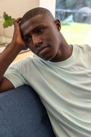 Contemplative African American Man Relaxing at Home