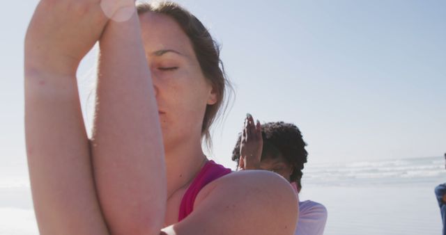 Women Practicing Yoga on Beach with Focused Expressions - Download Free Stock Images Pikwizard.com