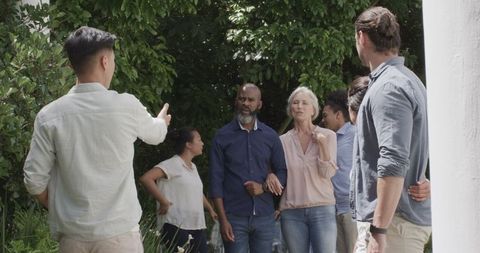 Guests Engaging Outdoors at Wedding Celebration