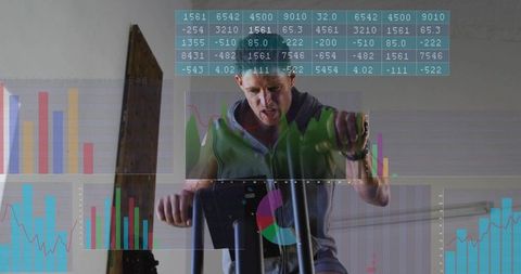 Man wearing green hoodie pedaling exercise bike with overlaid charts for fitness analytics