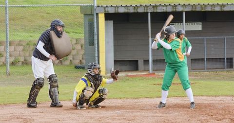 Diverse softball game action at community field