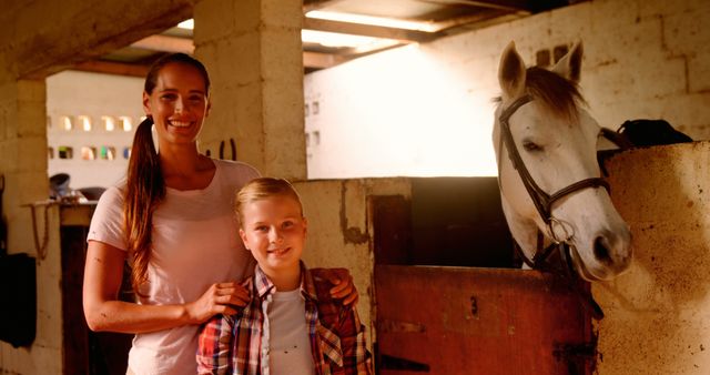 Mother and Son Enjoying Time at Stable with White Horse - Download Free Stock Images Pikwizard.com