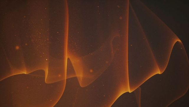 Graceful orange light waves on charcoal background