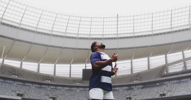 Rugby Player Celebrating in Empty Stadium, Raising Arms in Triumph - Download Free Stock Images Pikwizard.com