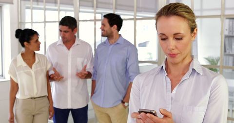 Female Designer Using Smartphone in Office Setting - Download Free Stock Images Pikwizard.com