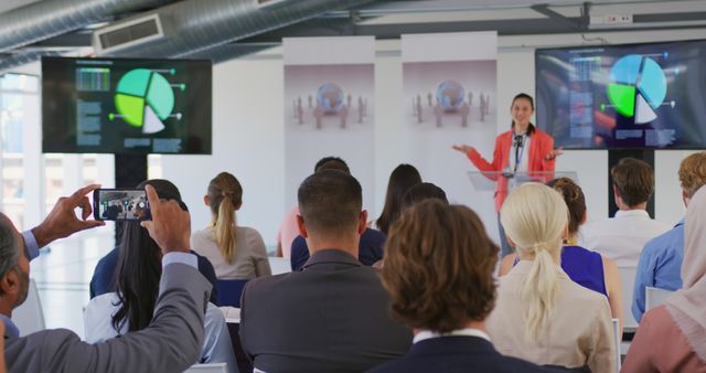 Businesswoman Presenting Charts to Team at Seminar - Download Free Stock Images Pikwizard.com