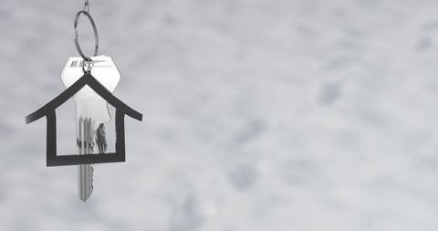 silver key with house shaped keychain on grey background - Download Free Stock Images Pikwizard.com