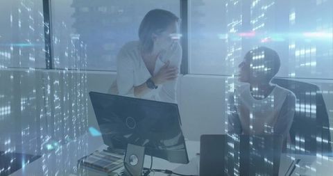 Dual-Tone Office Meeting: Businesswomen Collaborating