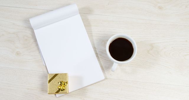 Blank Notepad with Coffee and Gift Box on Light Wood Desk - Download Free Stock Images Pikwizard.com