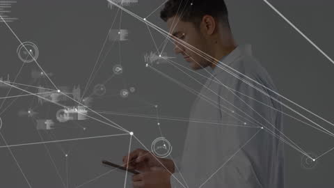 Male Doctor Using Tablet with Network Connections