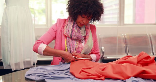 Fashion Designer Cutting Fabric in Colorful Studio - Download Free Stock Images Pikwizard.com