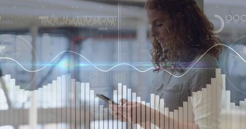Businesswoman Analyzing Mobile Data with Interactive Analytics Overlay in Modern Office