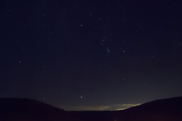 Starry Night Sky Over Hilltops - Download Free Stock Photos Pikwizard.com