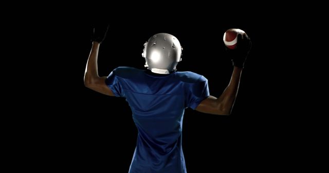 Quarterback Preparing to Throw Football in Action Spotlit Background - Download Free Stock Images Pikwizard.com