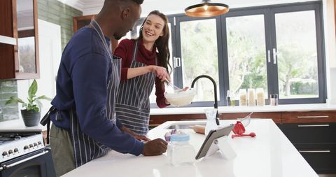 Diverse Couple Preparing Dough in Modern Kitchen