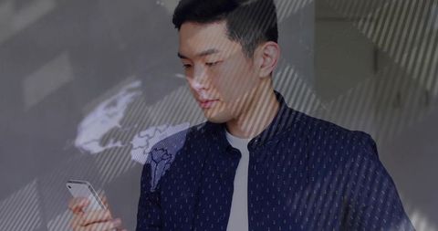 Professional Asian Man Using Smartphone in Futuristic Office Space