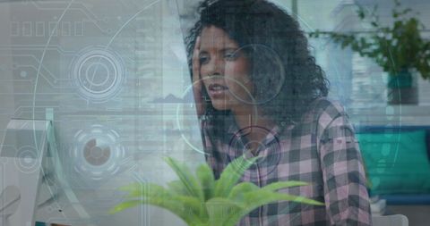 Businesswoman Studiously Analyzing Data With Headphones in Office