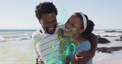 Joyful couple embracing on sunny beach with serene vibes